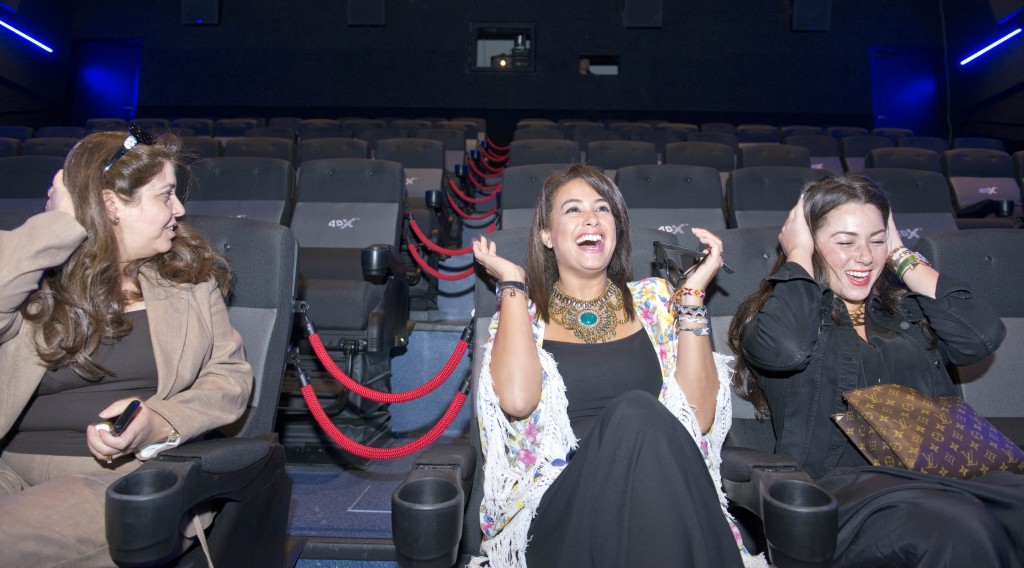 Hend Sabry feels the force of the 4DX effects of rain, wind and moving chairs at VOX Cinemas in Yas Mall