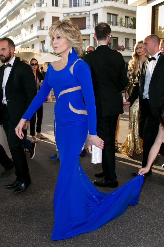Jane Fonda carrying a Salvatore Ferragamo silver Swarovski clutch - 68th Cannes Film Festival
