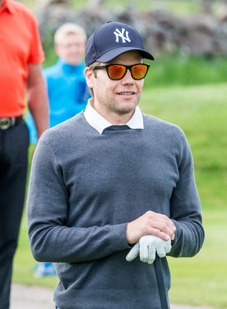 Prince Daniel golfing in trendy mirrored shades