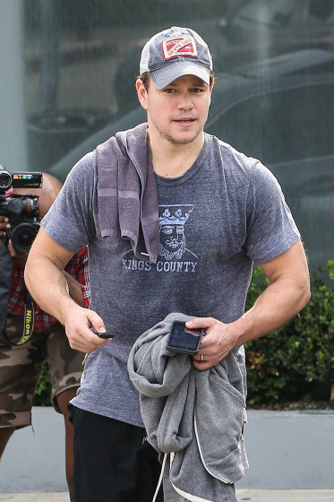 A buff and sweaty Matt Damon heads out after a workout