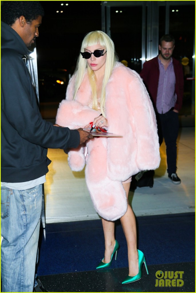 Lady Gaga Jets Out of New York Wearing a Baby Pink Fur Coat & Emerald Green Heels
