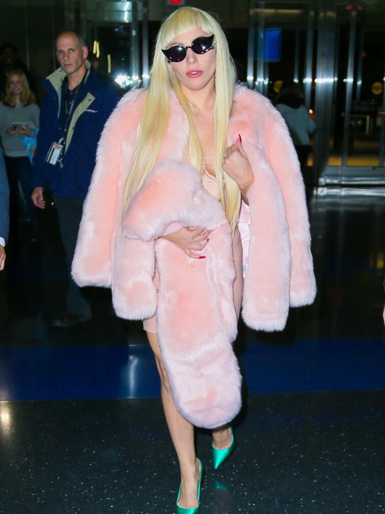 Lady Gaga Jets Out of New York Wearing a Baby Pink Fur Coat & Emerald Green Heels