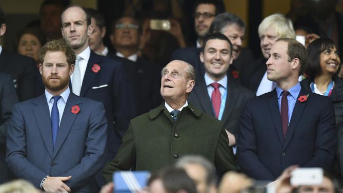 Britain's Prince Harry, Prince Philip and Prince William attend the Rugby World Cup final match between New Zealand against Australia at Twickenham in London