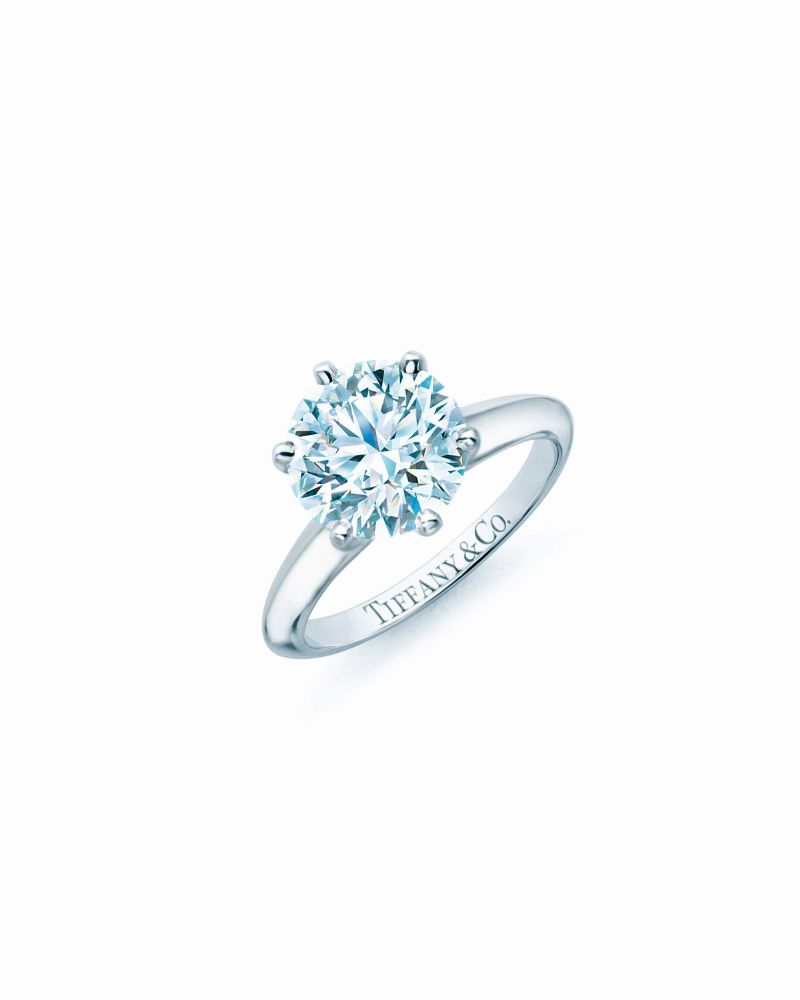 resized_The Tiffany® Setting, a design classic that holds the diamond away from the band on six prongs, permitting a more complete return of light through the diamond
