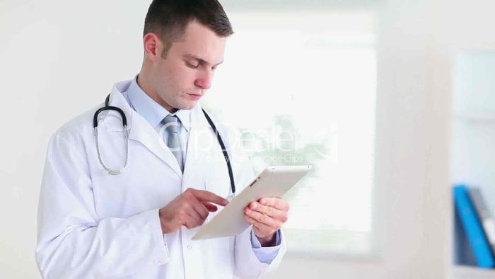 resized_12-1873978-Young-doctor-using-a-tablet-computer