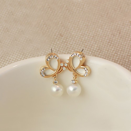 احدث اشكال حلق ذهب للاطفال بالاحجار الملونة