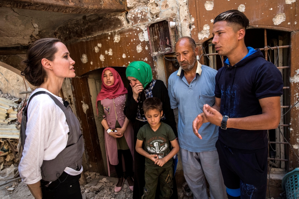 UNHCR Special Envoy Angelina Jolie meets with Mohamed and his family during a visit to the Old City in West Mosul